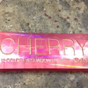 Color 12 Color "Cherry" eyeshadow palette. Colors are similar to Urban Decay.